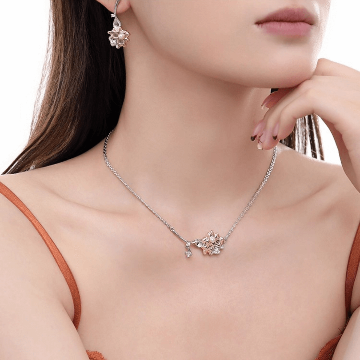 A woman wearing the Enola & SHE Waffle Pearl drop earrings, a chic accessory for women.